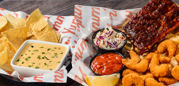 Dinner Double Feature - Whiskey River BBQ Ribs, Crispy Fried Shrimp, Bottomless Fries, andQueso Fundido
